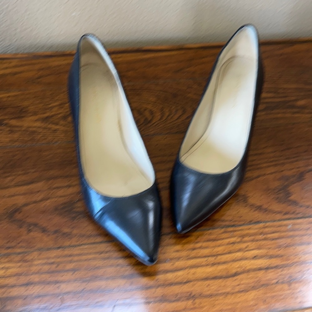 Black leather pumps